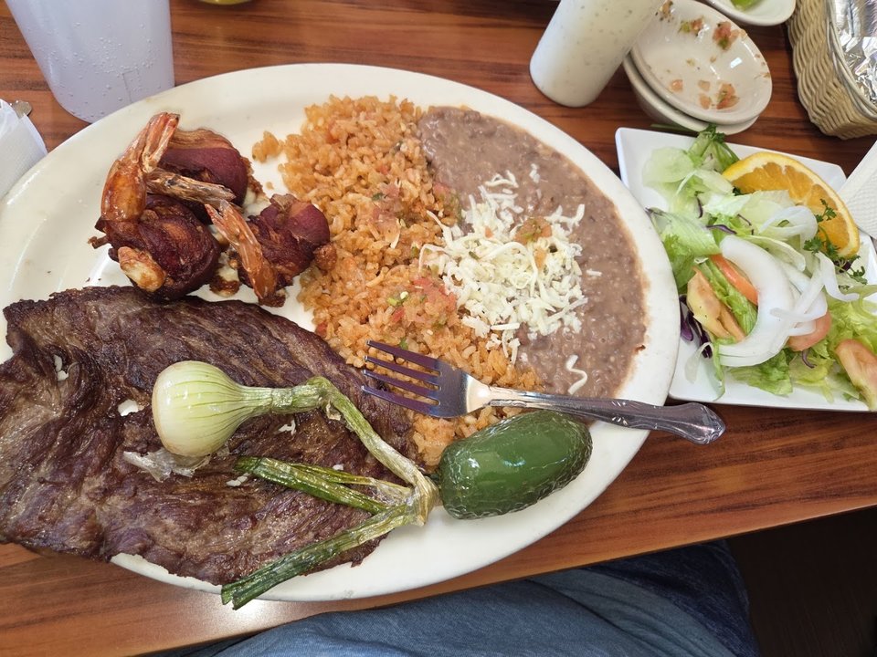 Crisp tostadas beside shrimp and ceviche